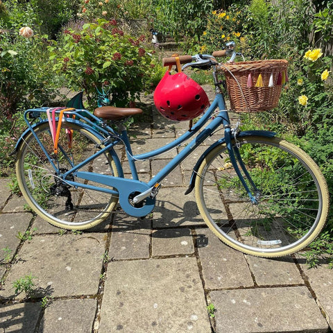 blue bike red helmet decorated mini tassels