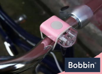 orange kids bike and helmet with tassels