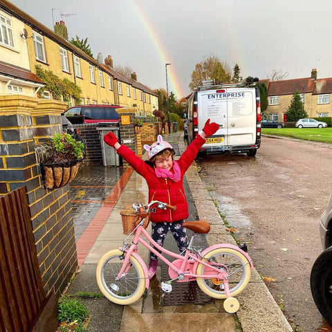 rainbow pink bike excited