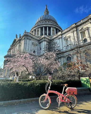 bike fold bike infront of cherry blossom london building